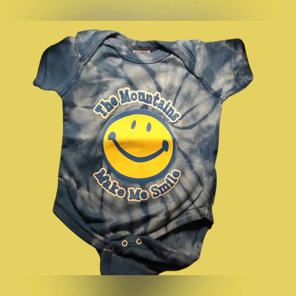 Tie-Dye Blue Baby Onesie with Yellow Smiley Graphic The Mountains Make Me Smile